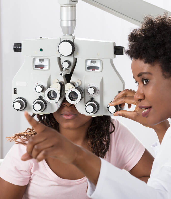 ophthalmologist doing patient eye exam